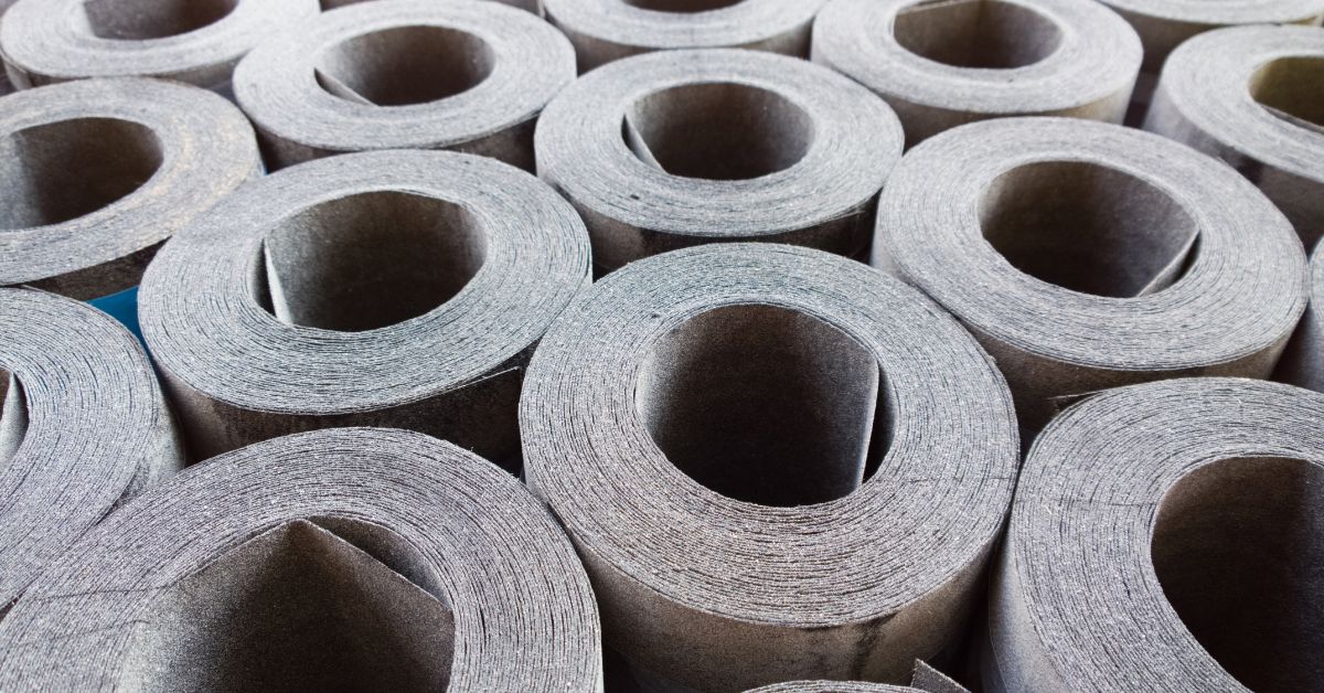 Synthetic and Felt Underlayment<br><p>Lighter rolls, often stacked several layers high, where the support under each layer determines whether the bottom row survives.</p>